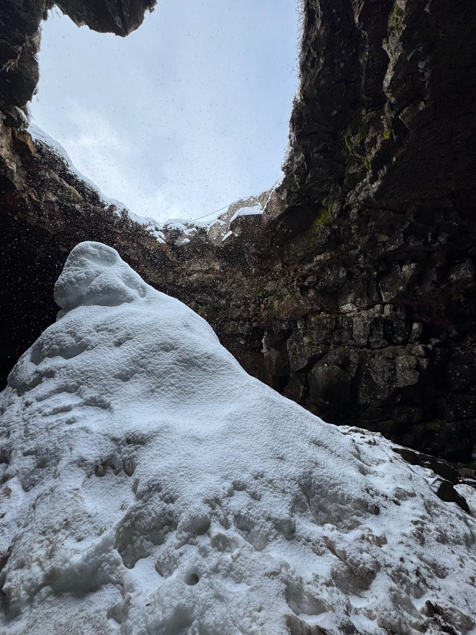 Snow and stone seen from an Icelandic cave